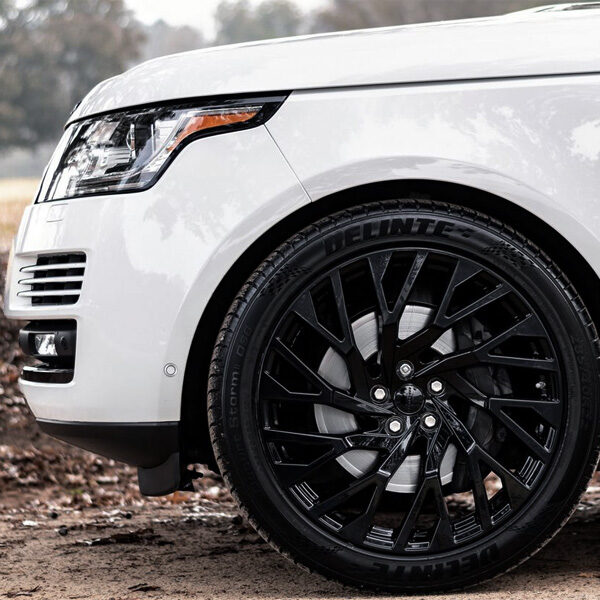 White SUV with black wheels