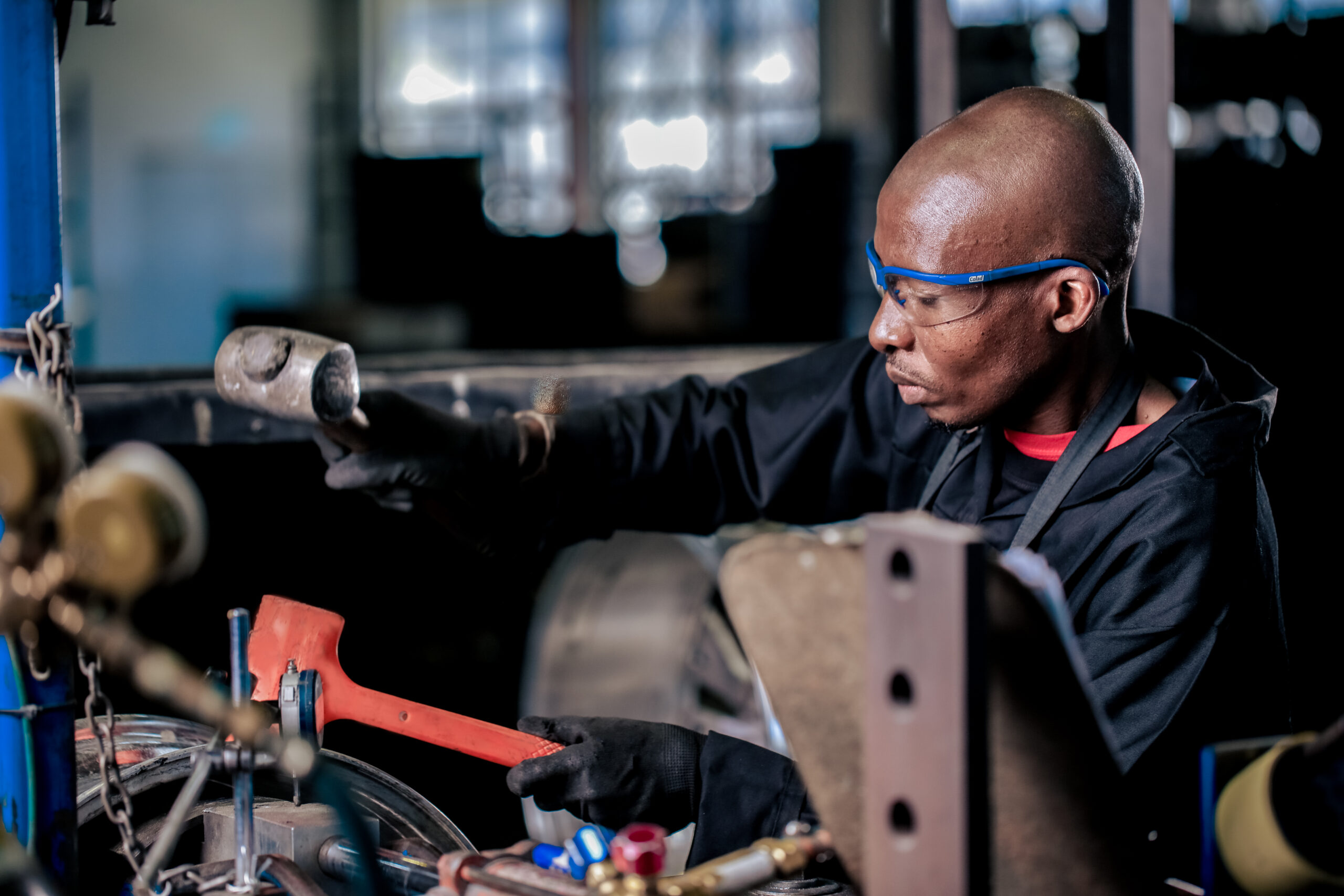 Man straightening a wheel